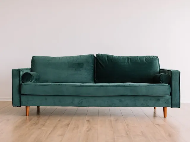 Couch ready for junk removal pickup in Port Huron